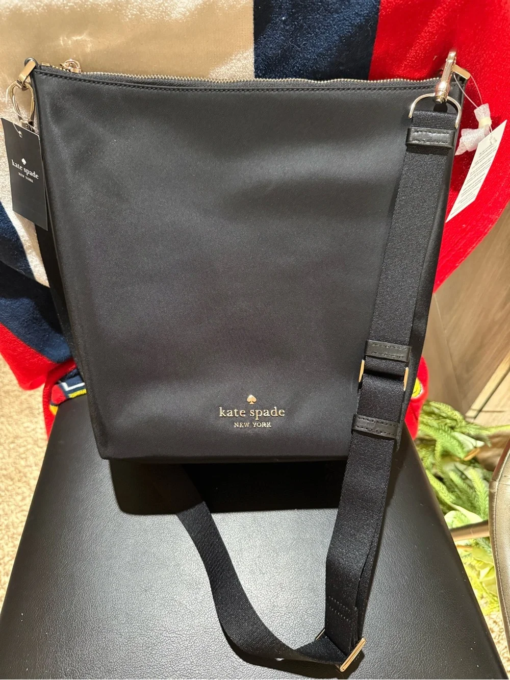 kate spade black nylon messenger crossbody with gold logo